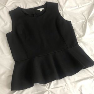Black peplum shirt.